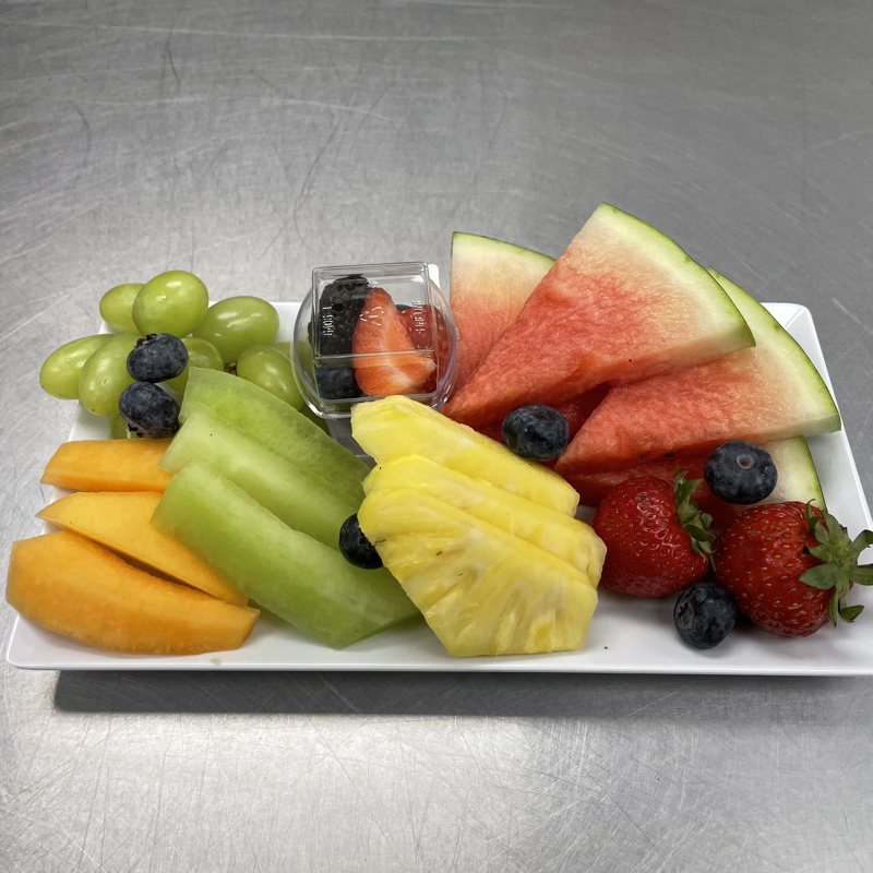 Fresh fruit platter with melon, pineapple and berries